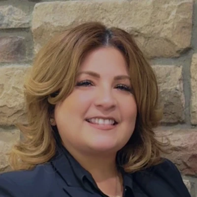 A headshot photo of Celina, the office manager
